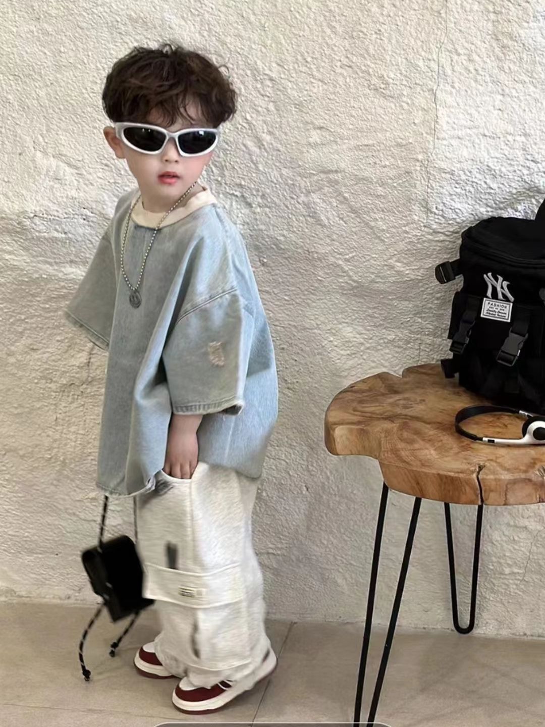 Children's denim short-sleeve top with distinctive ripped design